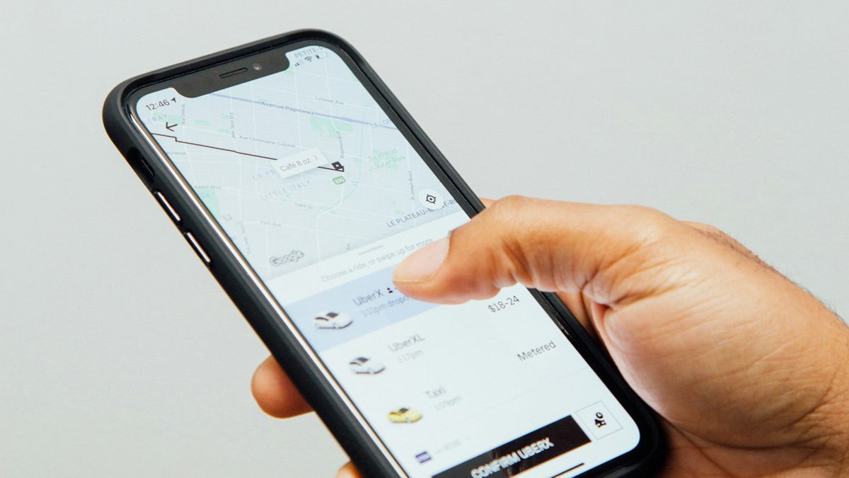 Person holding a phone ready to contact a business
