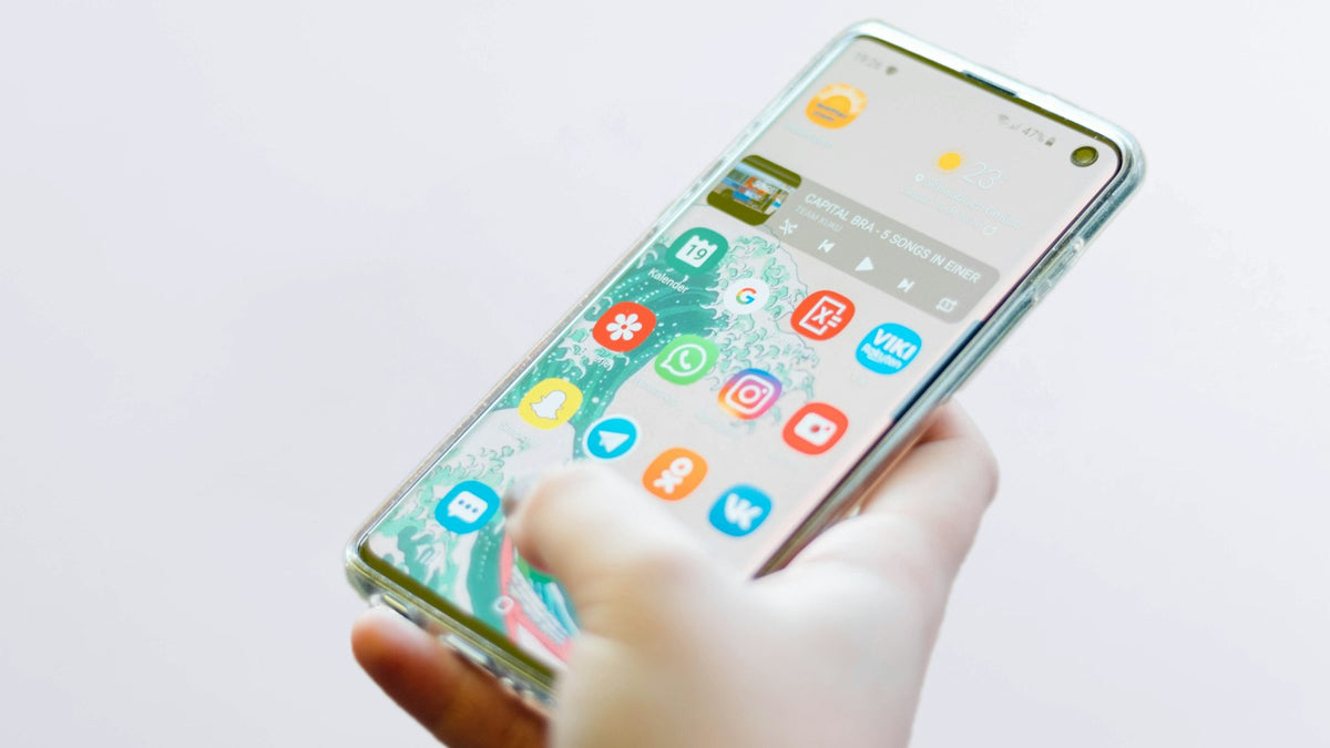 Person scrolling social media on a smartphone