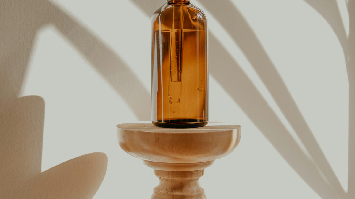 Gold and black product bottle photographed for an online store